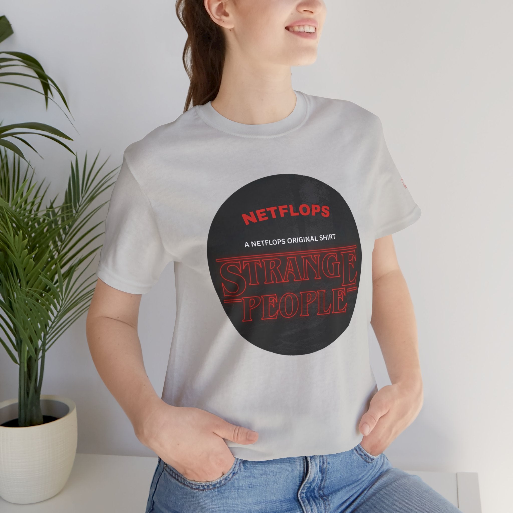 Strange People by NetFlops T-Shirt