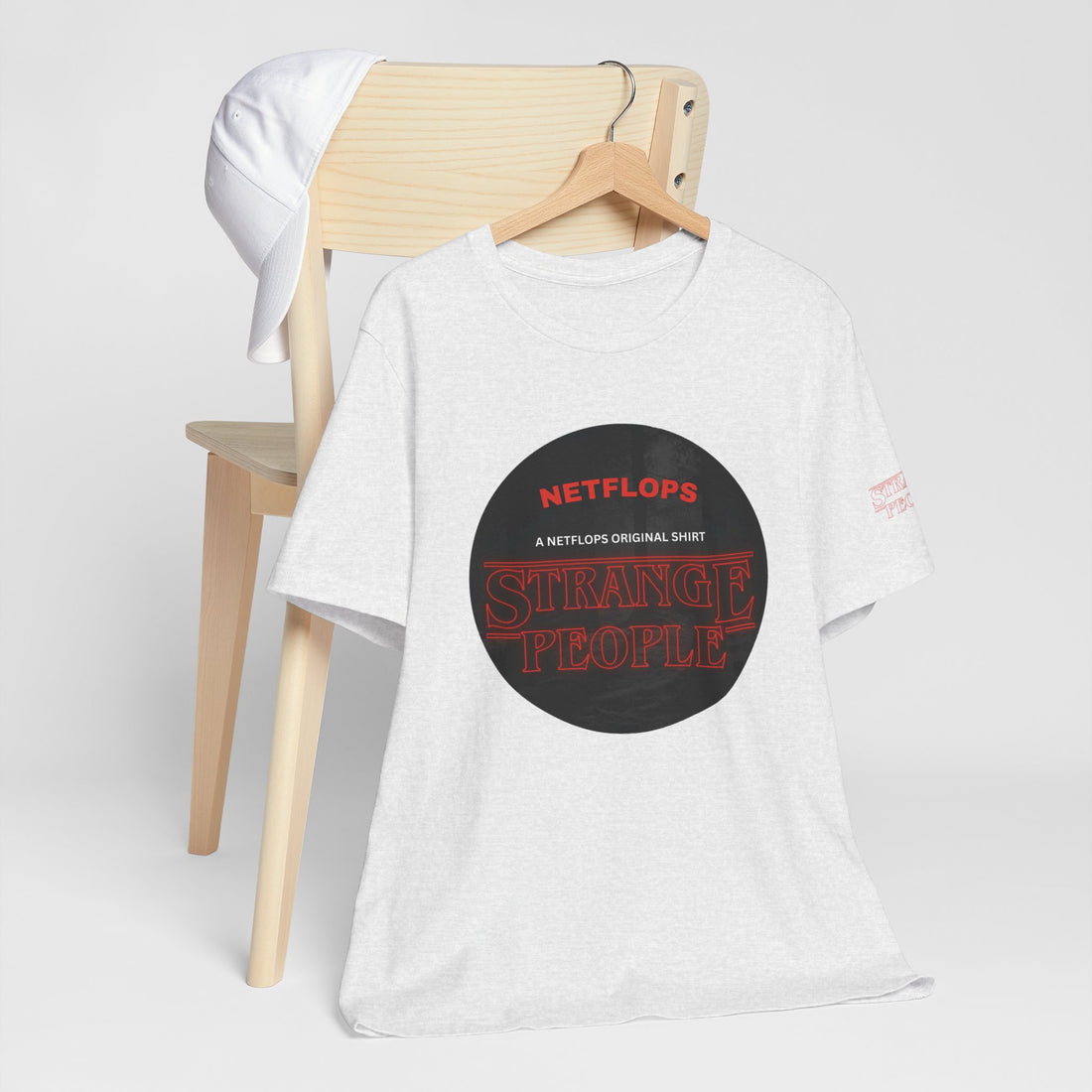 Strange People by NetFlops T-Shirt