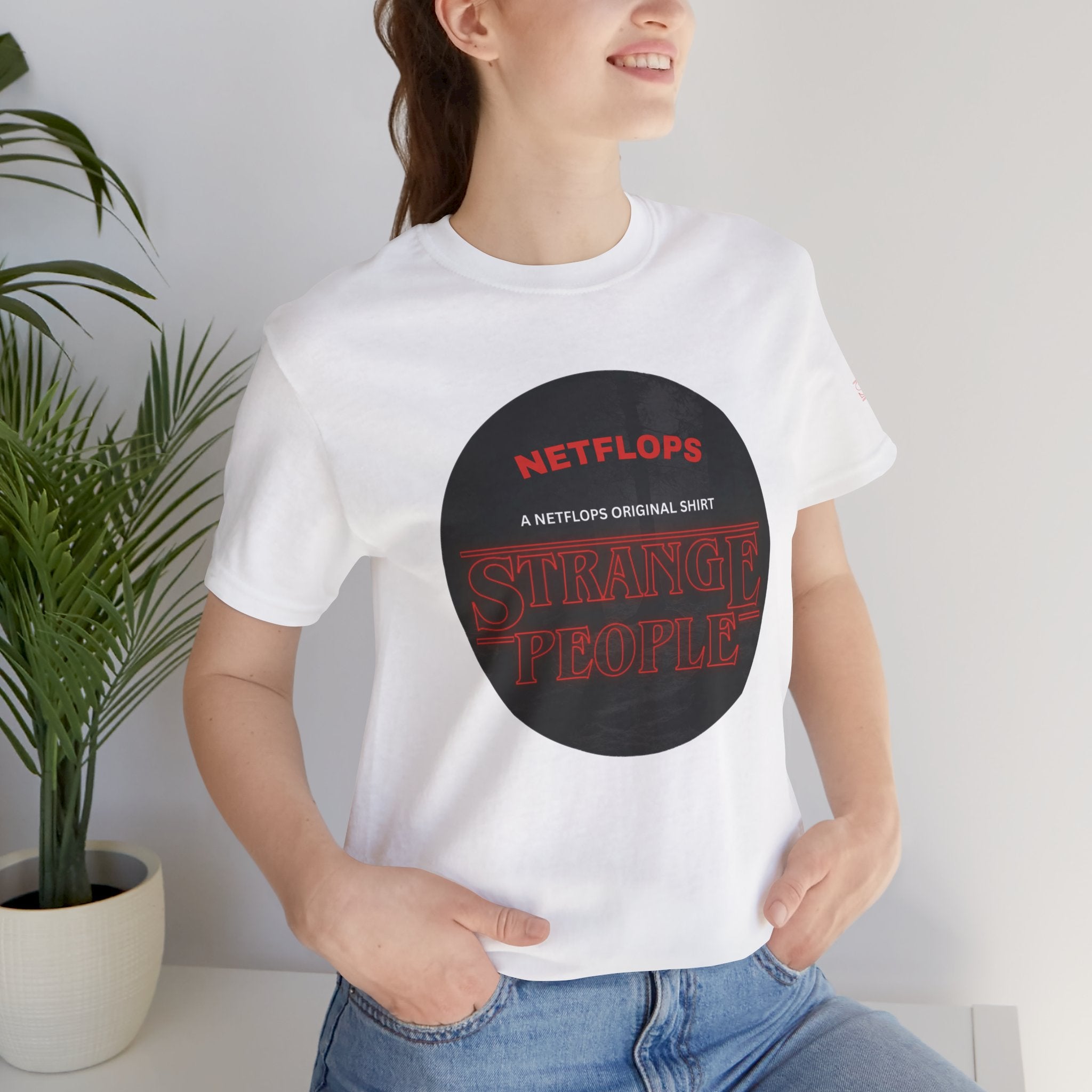 Strange People by NetFlops T-Shirt