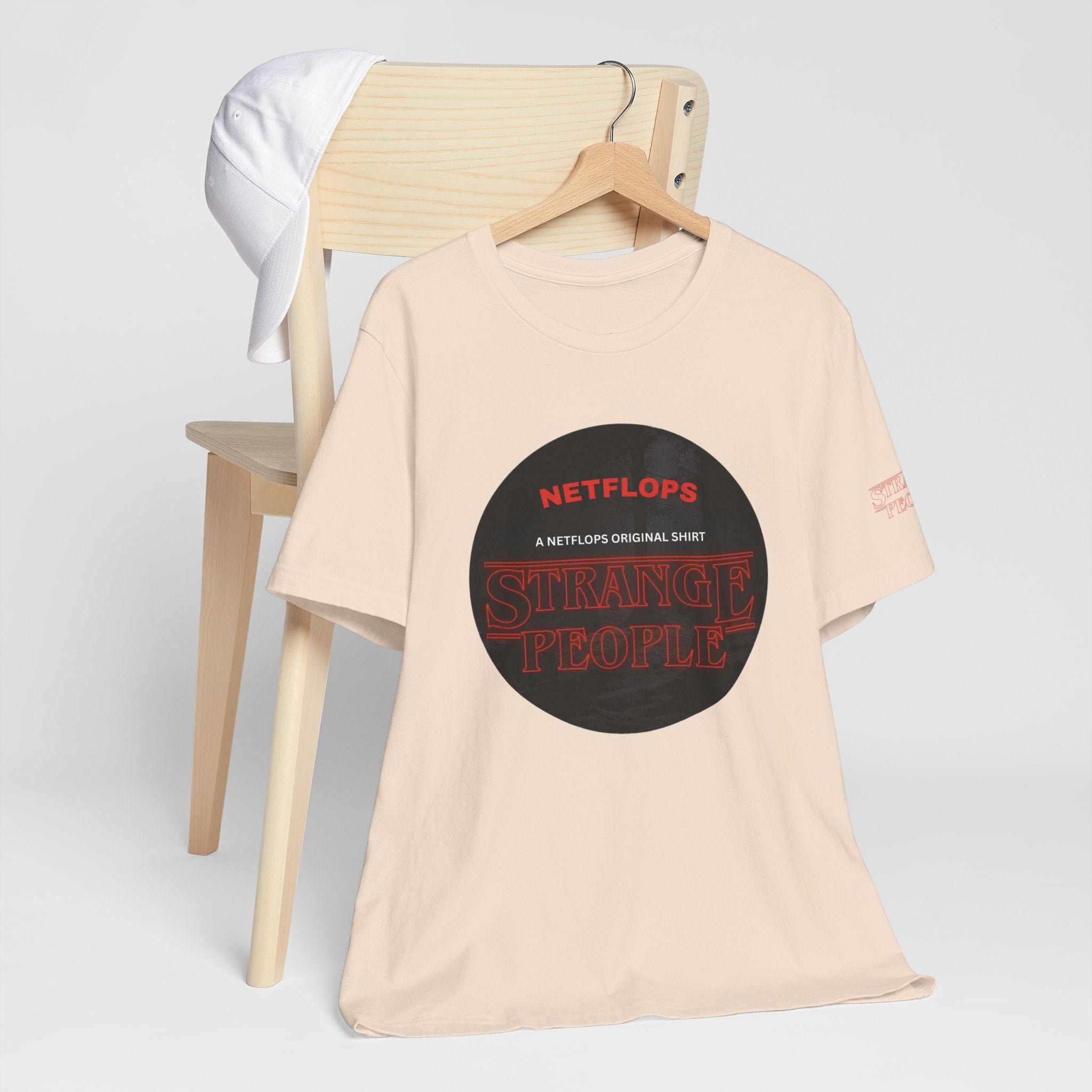 Strange People by NetFlops T-Shirt