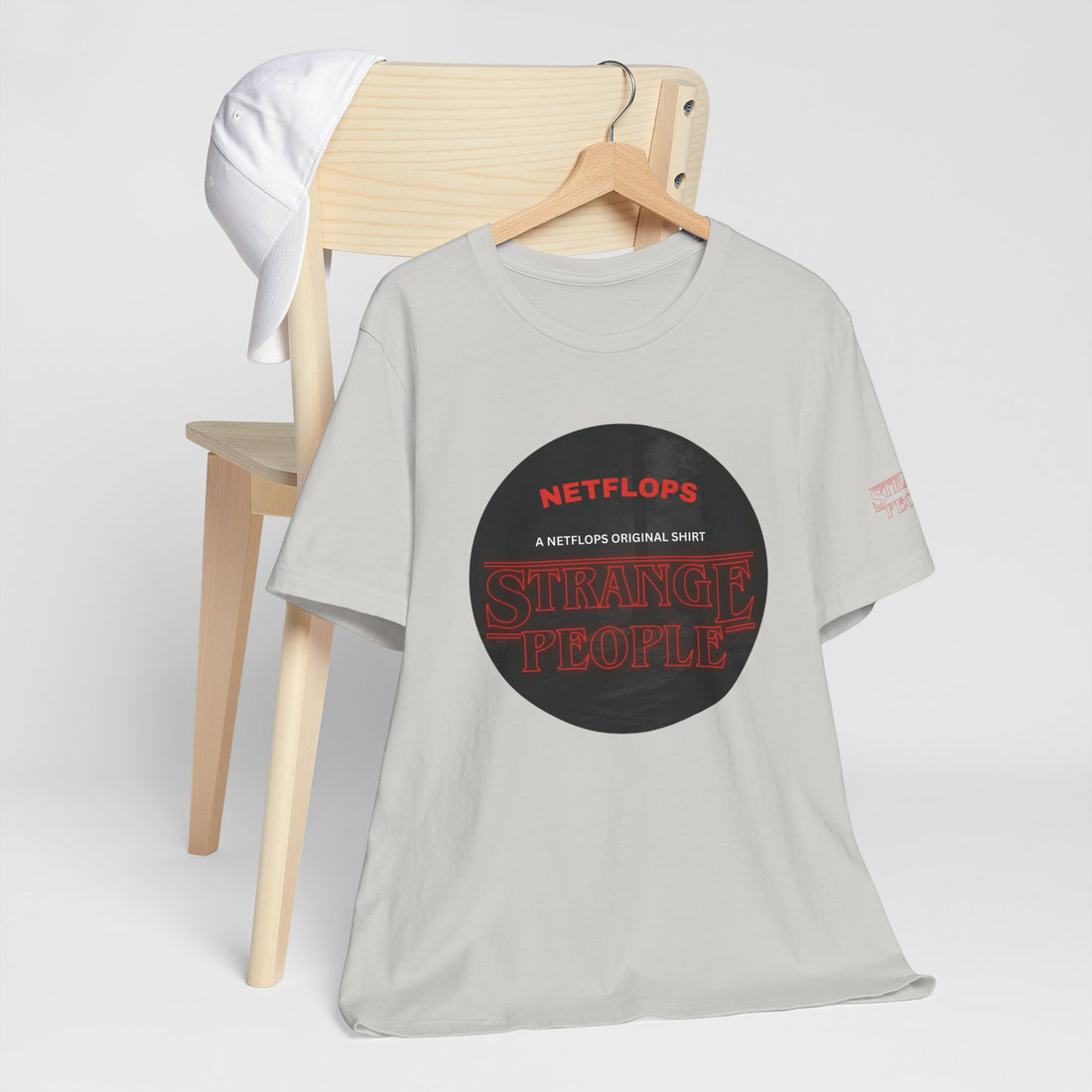 Strange People by NetFlops T-Shirt