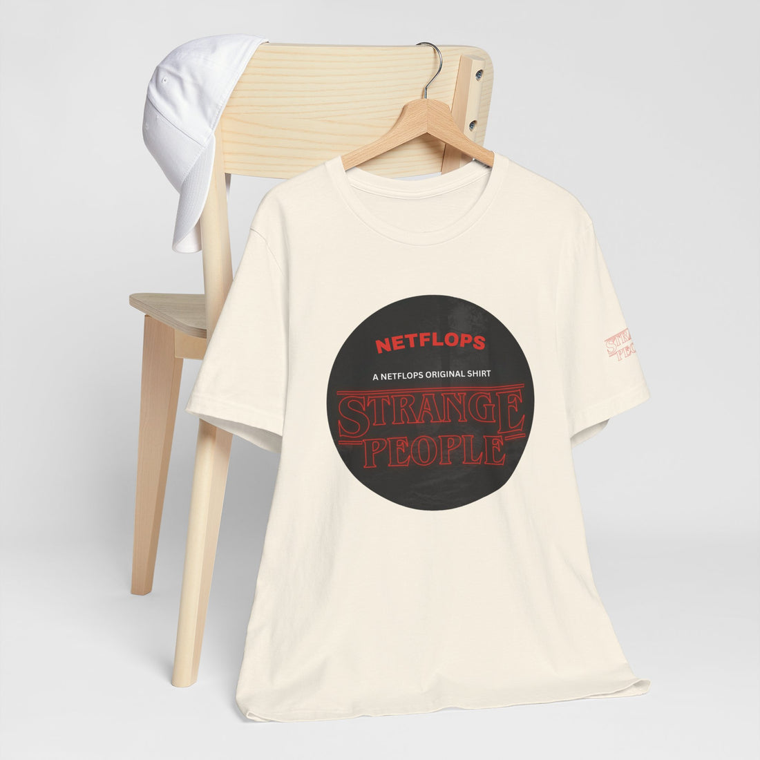 Strange People by NetFlops T-Shirt
