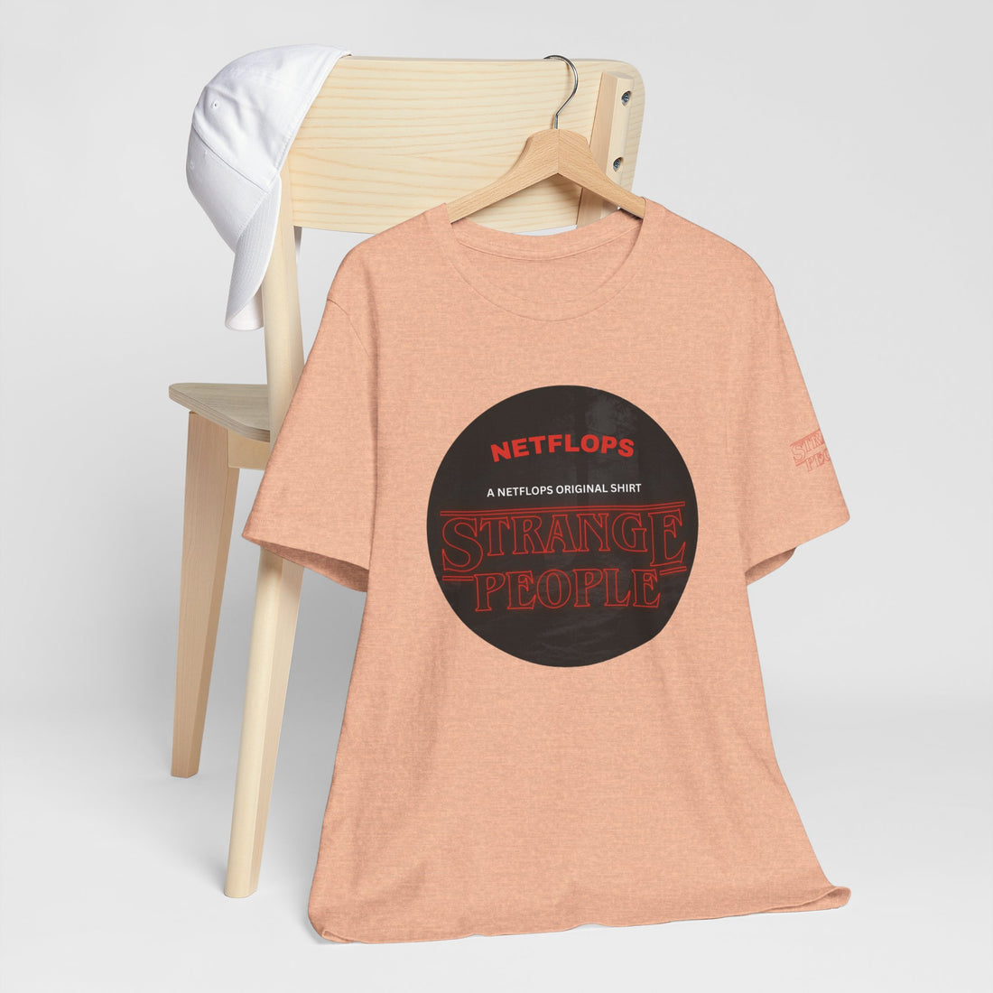 Strange People by NetFlops T-Shirt