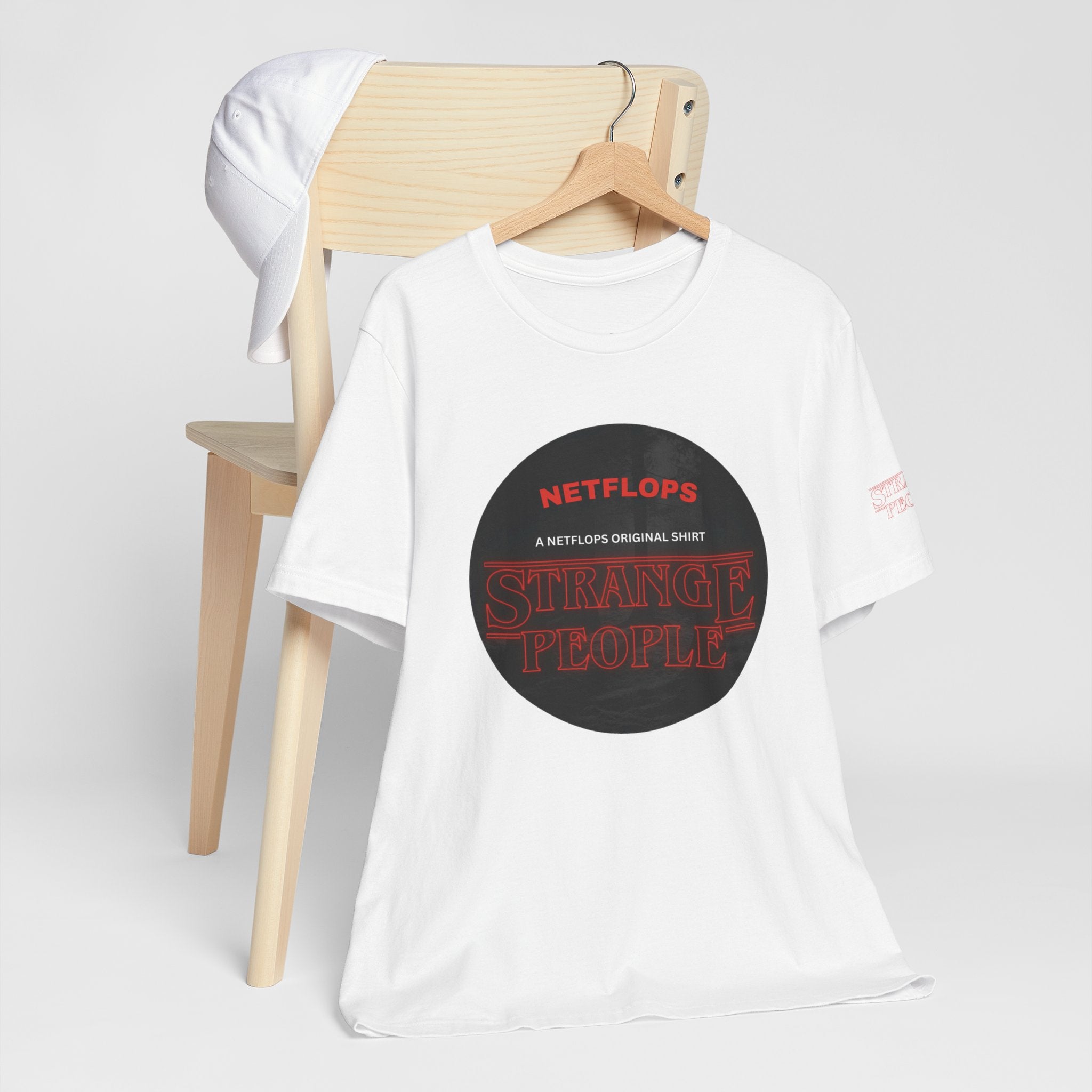 Strange People by NetFlops T-Shirt
