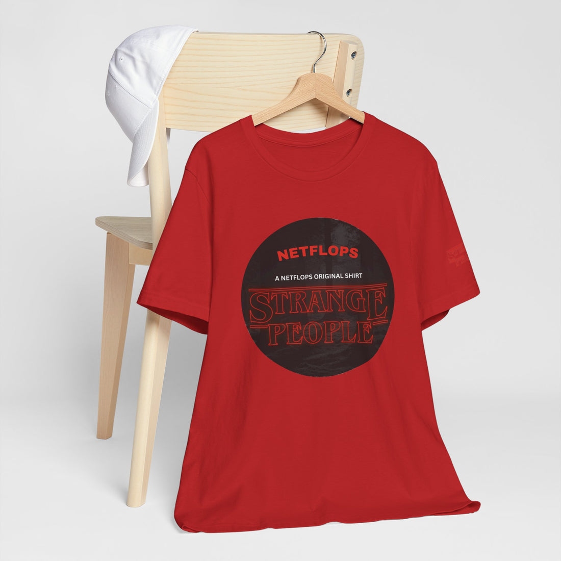 Strange People by NetFlops T-Shirt